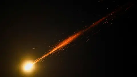 Reuters Missiles launched from Iran are intercepted as seen from Ashkelon, Israel