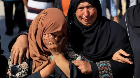 Reuters Mourners react following deaths of Palestinians in Israeli fire near a distribution site in Rafah. 
