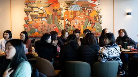 Getty Images A busy Starbucks cafe in South Korea
