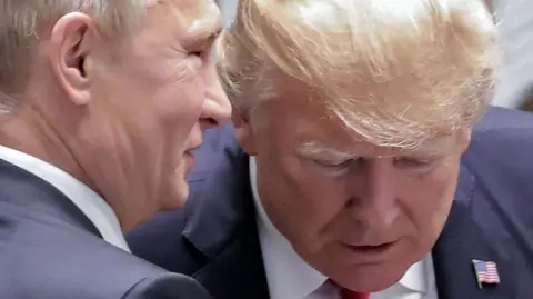Getty Images Putin whispering in Trump's ear