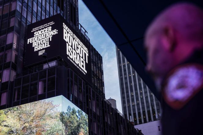 An electronic billboard in Times Square, New York (United States), displaying the message 'Football federations: boycott Israel,' September 16, 2025.