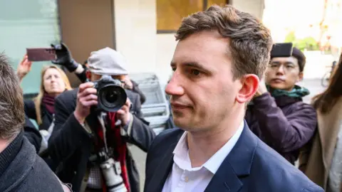 Getty Images Christopher Cash arrives at Westminster Magistrates Court in April 2024 