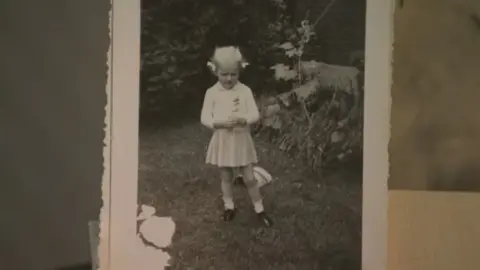 Submitted photo An old black-white photo of Lana Ponting as a little girl. She is in a light-coloured  dress and her short blond hair is in pigtails.