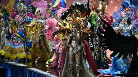 Getty Images Miss Universe candidates wearing national costumes