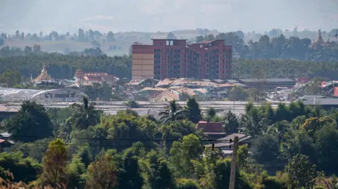 BBC/ Jonathan Head KK Park as seen from across the Thai-Myanmar border.