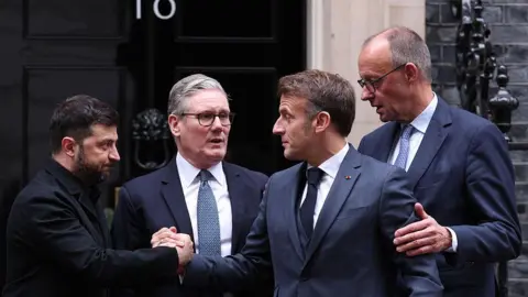 Getty Images Ukraine's President Volodymyr Zelensky, Britain's Prime Minister Keir Starmer, France's President Emmanuel Macron and Germany's Chancellor Friedrich Merz on the 10 Downing Street doorstep