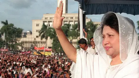 Getty Images Khaleda Zia waves at her supporters 22 June before addressing a protest rally at Dhaka's downtown Paltan Maidan ground.
