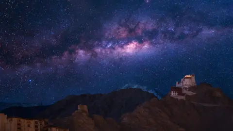 Getty Images Extreme long exposure image showing milky way with Namgyal Tsemo Gompa, main buddhist monastery centre in Leh, Ladakh, India