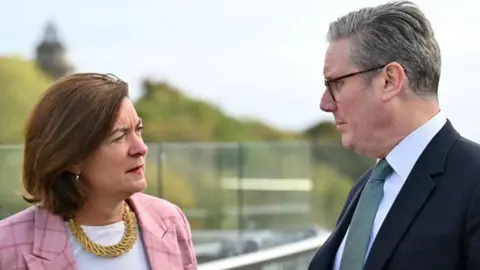 Reuters Eluned Morgan and Sir Keir Starmer stood at Queen Elizabeth House in Edinburgh, Scotland.