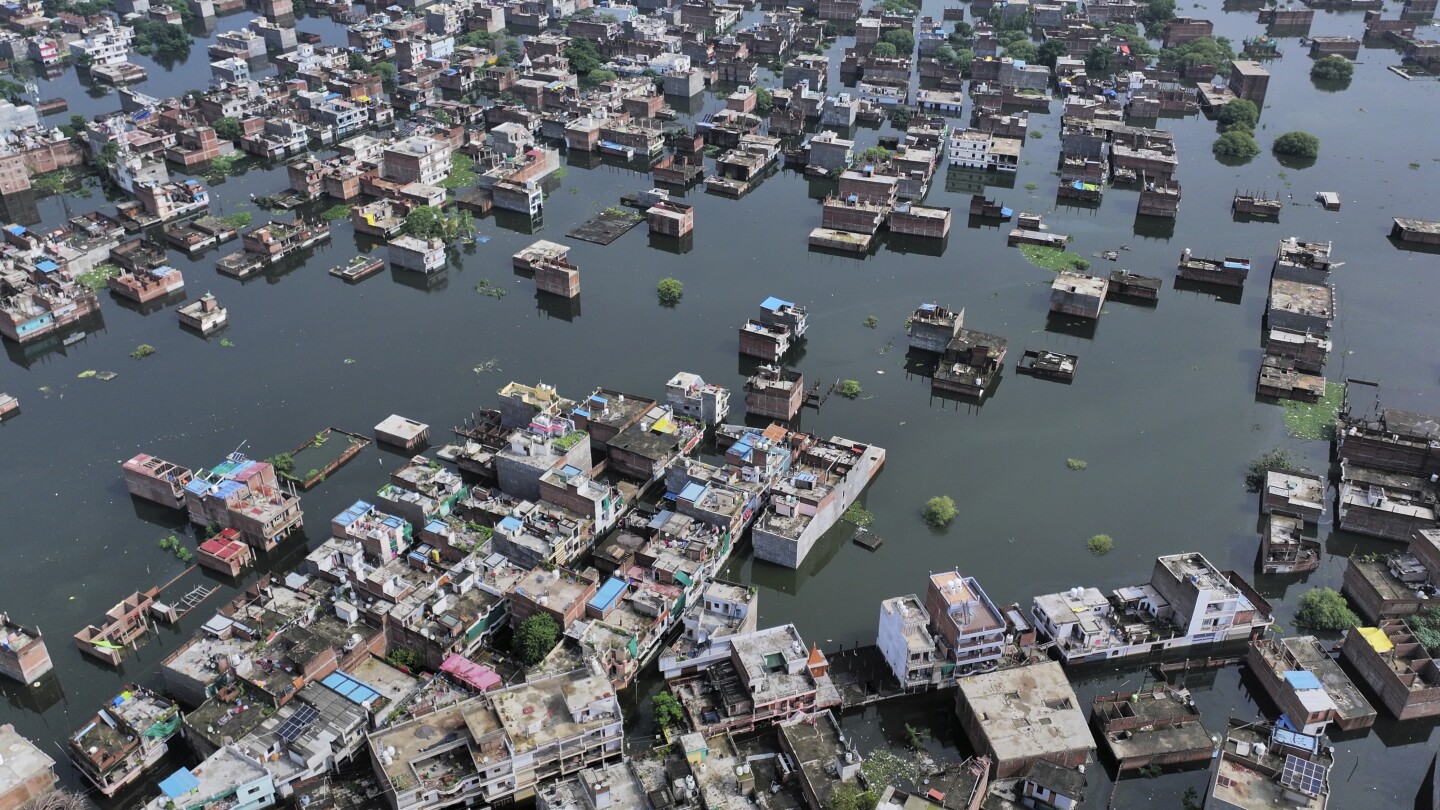 Flash floods kill at least 4 and trap others under debris in northern India