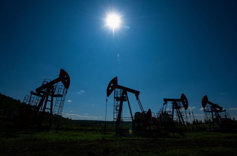 Oil prices little changed as Russia, Mideast concerns offset by oversupply worry