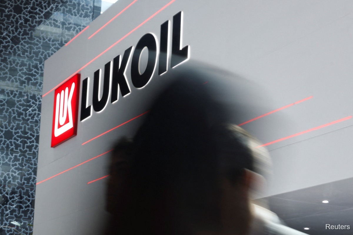 Russia’s Lukoil, under sanctions, agrees to sell international assets to US Carlyle Group