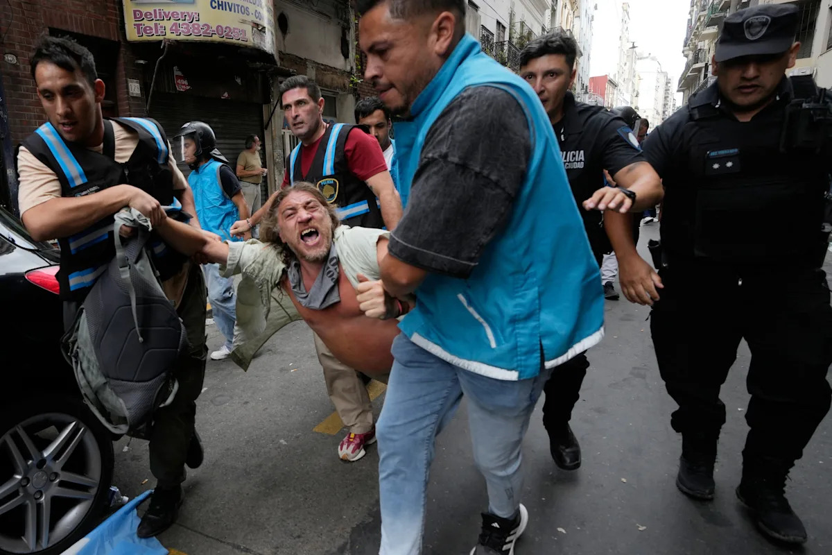 Argentine workers clash with police as senators debate labor reform, in photos